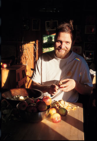 Chris slices into the apple harvest. Photo by Neha Shukla